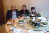 Enjoying tasty Chinese food with friends