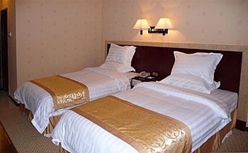 Guest Room - Colorful Holiday Hotel - Libo