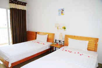 Garden view twin bed room - Fangjie Holiday Apartment Sanya